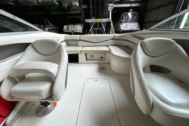 Slide: The Image of 2005 Maxum 2200 SR3 boat interior with white seating and spacious layout. - 4