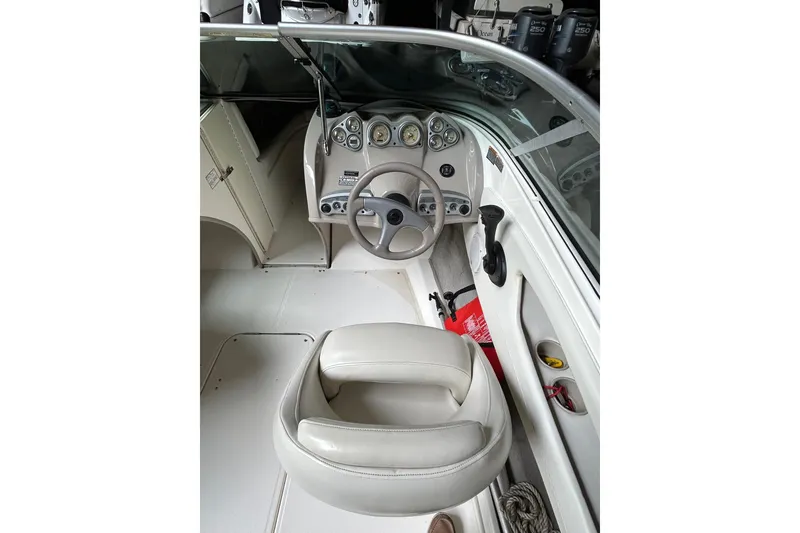 Slide: The Image of 2005 Maxum 2200 SR3 boat interior with steering wheel and dashboard controls. - 7