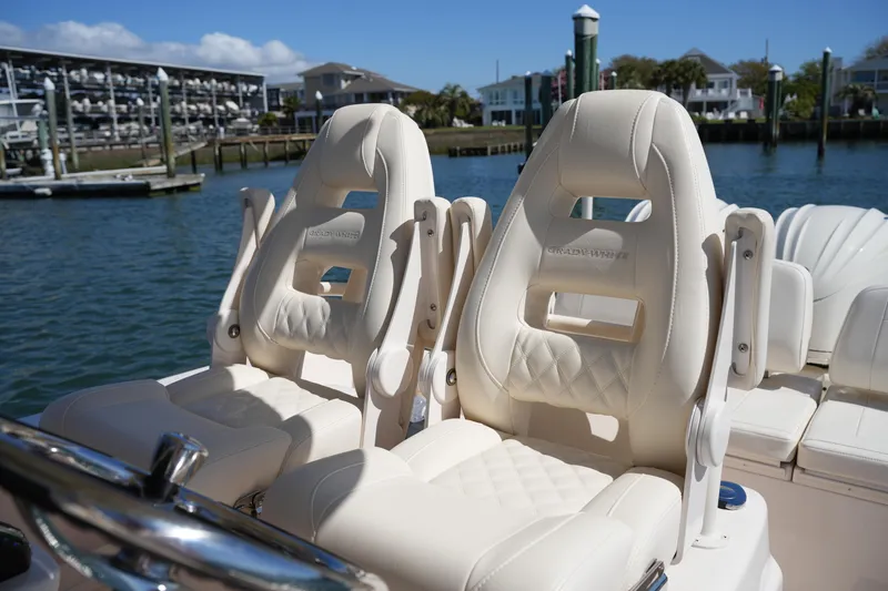 Slide: The Image of Luxury seating on 2025 Grady-White 281 Coastal Explorer boat, dockside view. - 25