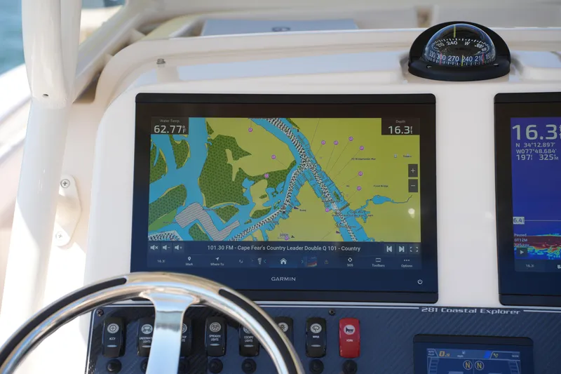 Slide: The Image of Dashboard of 2025 Grady-White 281 Coastal Explorer with Garmin navigation display. - 28