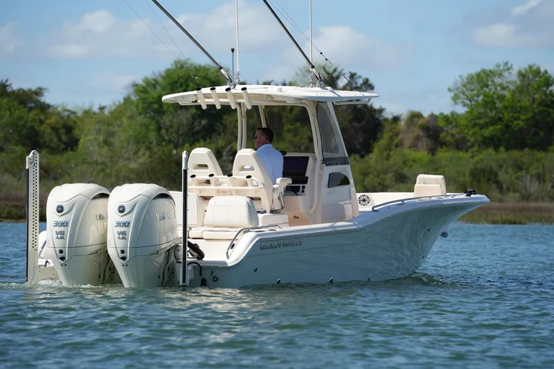 Slide: The Image of 2025 Grady-White 281 Coastal Explorer boat on water, featuring dual Yamaha engines. - 3
