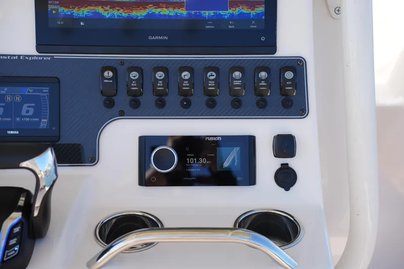 Slide: The Image of Control panel of 2025 Grady-White 281 Coastal Explorer boat with Garmin and Fusion displays. - 30