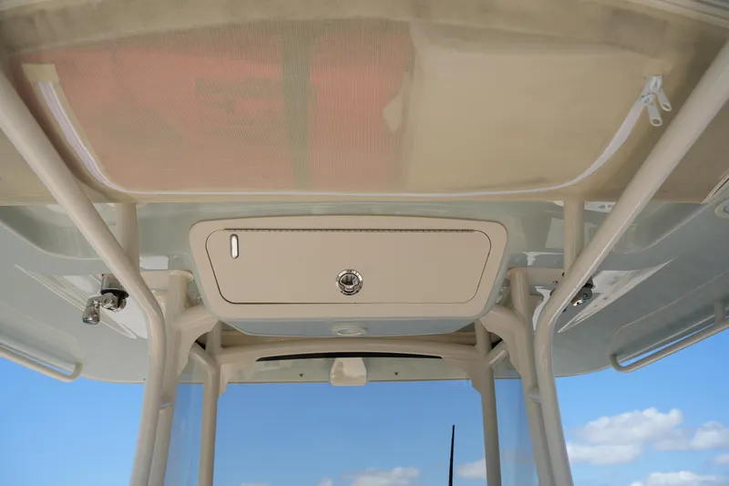 Slide: The Image of 2025 Grady-White 281 Coastal Explorer boat roof storage compartment, featuring sleek design and sturdy construction. - 33