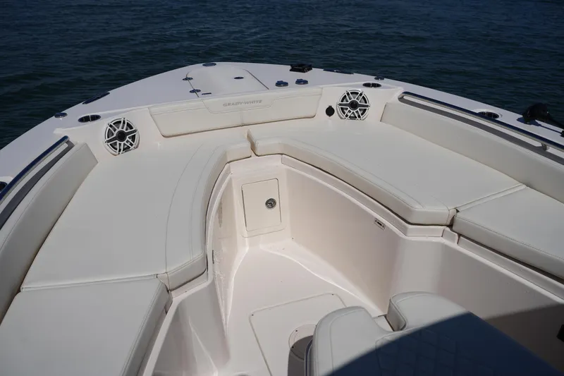 Slide: The Image of 2025 Grady-White 281 Coastal Explorer boat interior with cushioned seating and speakers. - 42