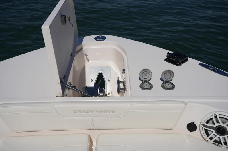 Slide: The Image of 2025 Grady-White 281 Coastal Explorer boat deck with anchor compartment and speaker. - 44
