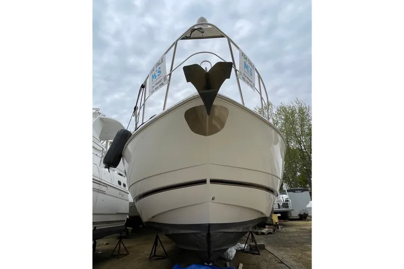 Slide: The Image of 2004 Cruisers Yachts 455 Express Motoryacht on display, front view with anchor. - 20