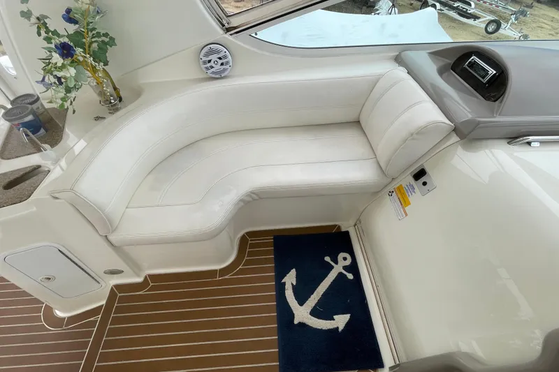 Slide: The Image of Luxurious interior of 2004 Cruisers Yachts 455 Express Motoryacht with white seating and nautical decor. - 31