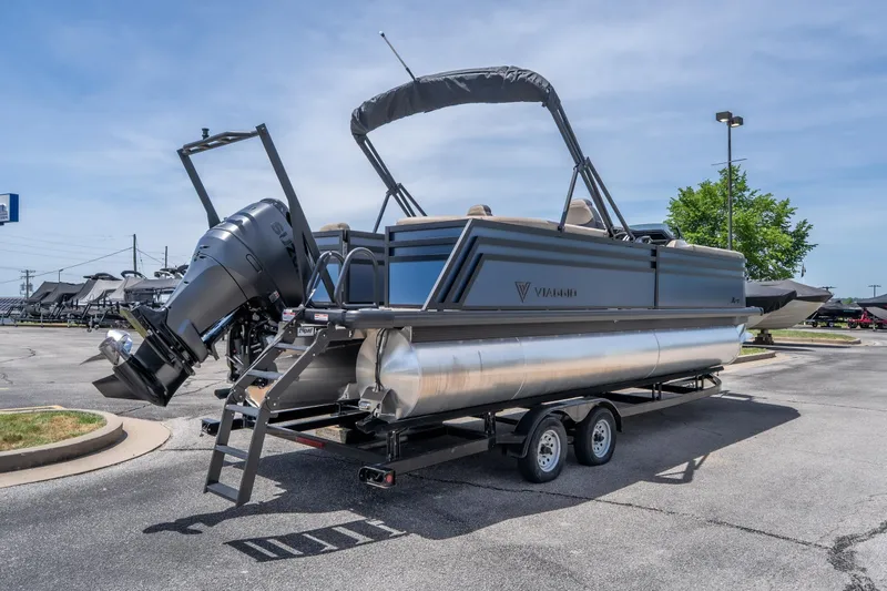 Slide: The Image of 2026 Viaggio X24U pontoon boat on trailer, featuring sleek design and powerful outboard motor. - 11
