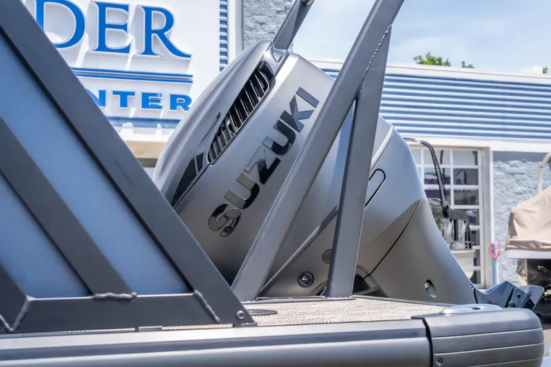 Slide: The Image of 2026 Viaggio X24U with Suzuki outboard motor at dealership. - 14