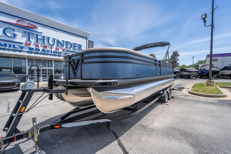 Slide: The Image of 2026 Viaggio X24U pontoon boat on trailer at Big Thunder Marine dealership. - 16