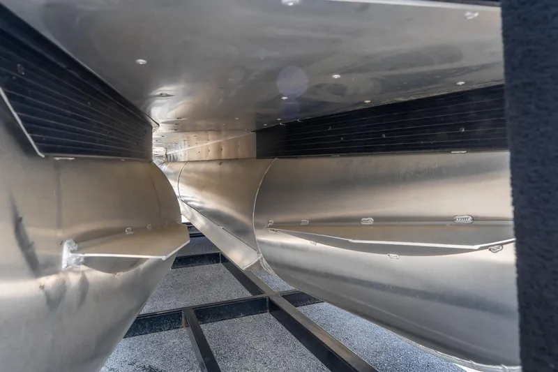 Slide: The Image of Underneath view of 2026 Viaggio X24U pontoon boat, showcasing sleek aluminum construction. - 19