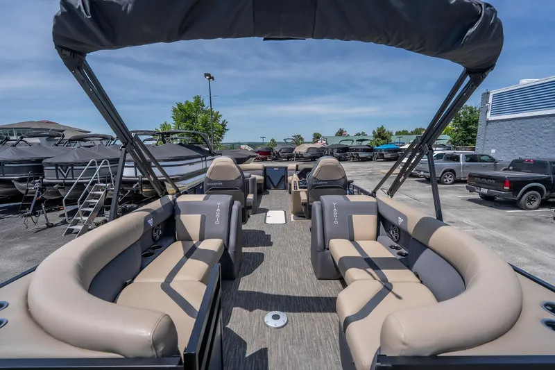 Slide: The Image of 2026 Viaggio X24U pontoon boat with spacious seating and modern design at a dealership. - 21