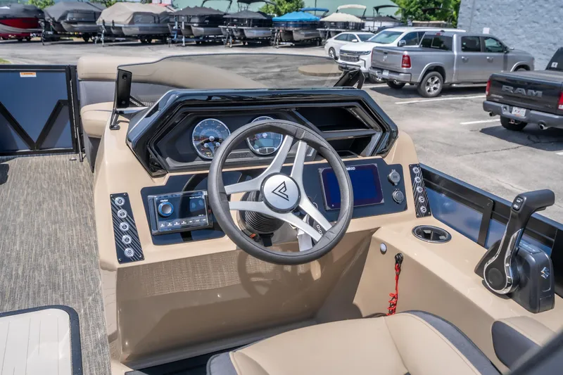 Slide: The Image of Interior view of 2026 Viaggio X24U boat dashboard with steering wheel and controls. - 25