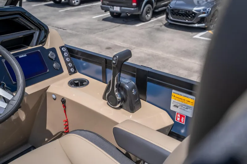Slide: The Image of Interior of 2026 Viaggio X24U boat, featuring control panel and throttle lever. - 26