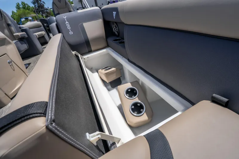 Slide: The Image of Viaggio X24U 2026 boat interior with open storage compartment and cup holders. - 37