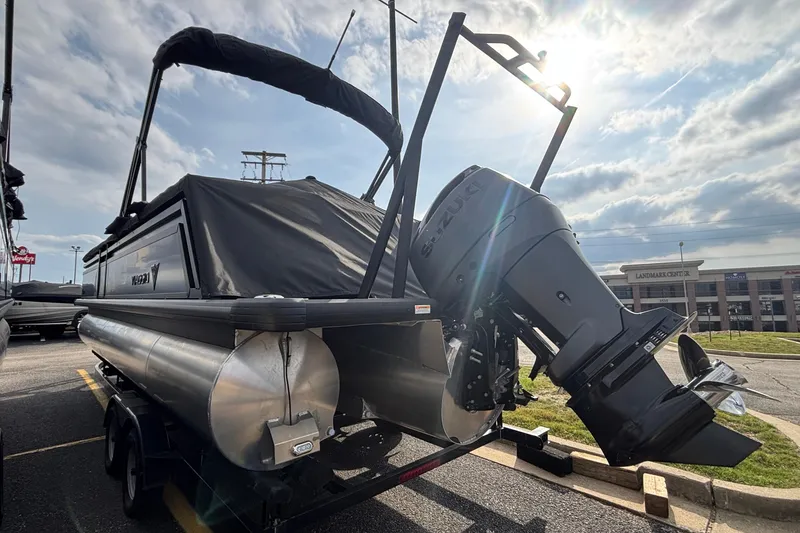 Slide: The Image of 2026 Viaggio X24U pontoon boat with Suzuki outboard motor in a parking lot. - 4