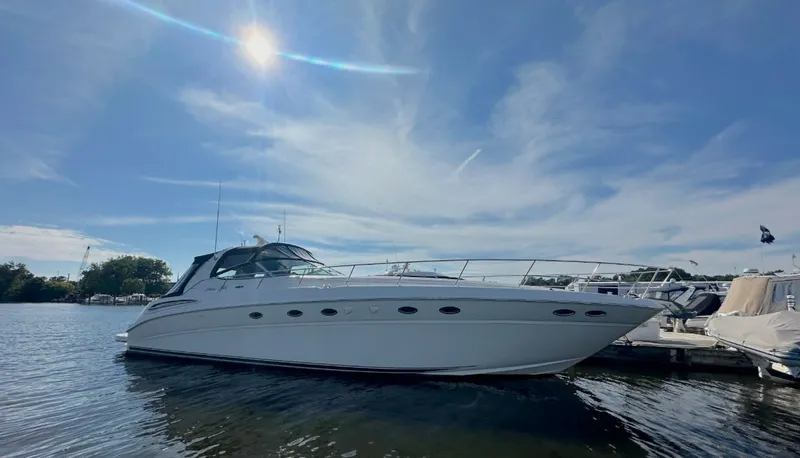 The Image of 2001 Sea Ray Sundancer 510 yacht docked under sunny sky. - 0