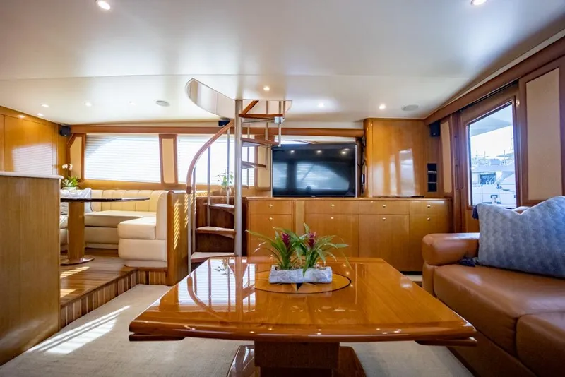 Slide: The Image of Luxurious interior of 2003 Viking 65 EB yacht with elegant wood finishes and modern amenities. - 42