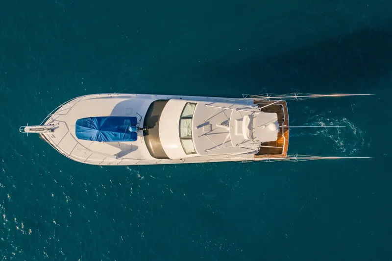 Slide: The Image of Aerial view of 2003 Viking 65 EB yacht on blue ocean water. - 5