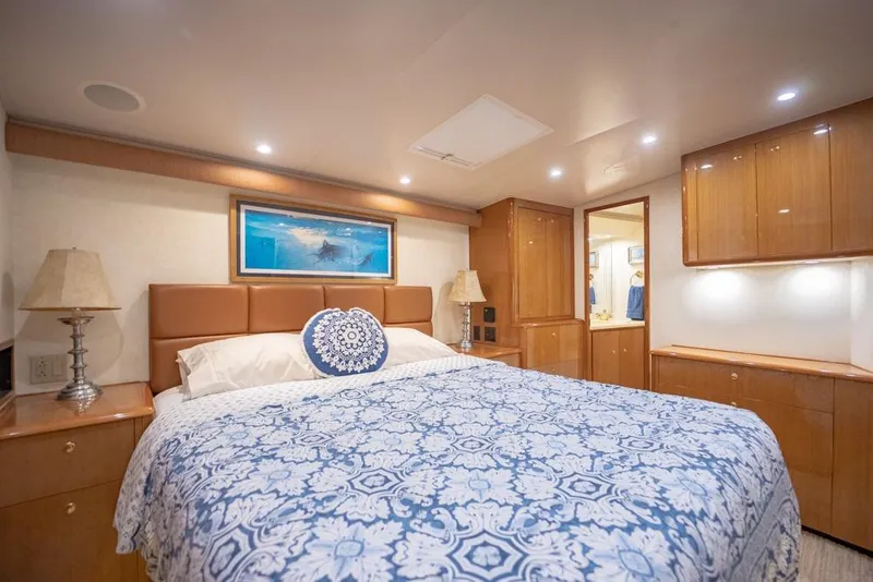 Slide: The Image of Luxurious bedroom interior of 2003 Viking 65 EB yacht with elegant wood cabinetry. - 50