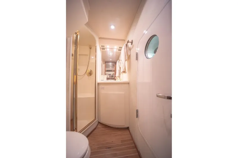 Slide: The Image of Luxurious bathroom interior of 2003 Viking 65 EB yacht with shower and vanity. - 54