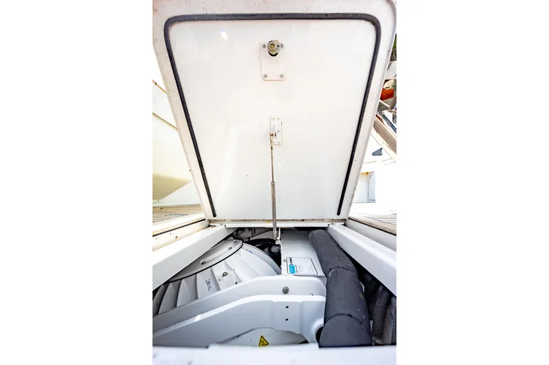 Slide: The Image of Engine compartment of a 2003 Viking 65 EB yacht, showcasing mechanical components. - 55