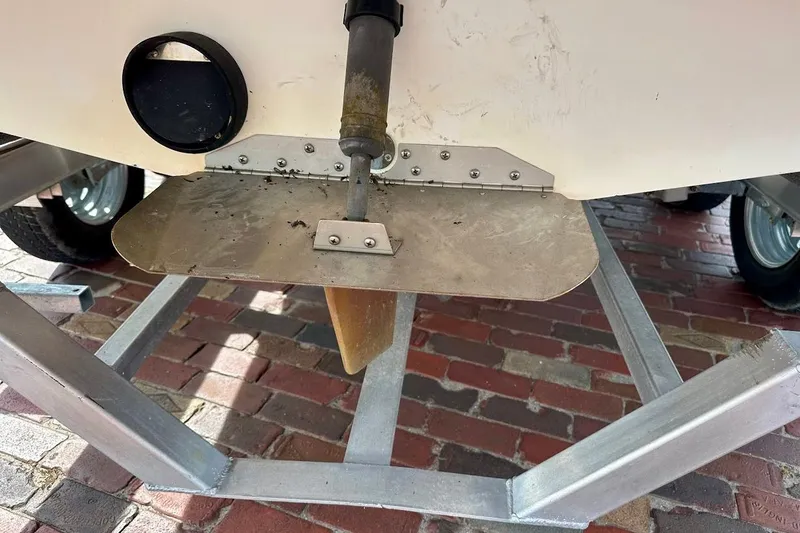 Slide: The Image of 2012 Tigé R20 boat rudder and propeller on a trailer. - 13