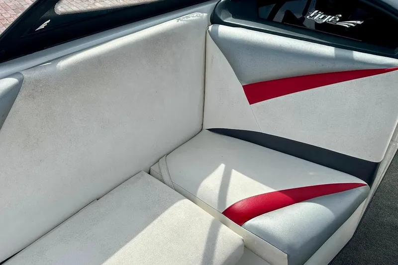 Slide: The Image of 2012 Tigé R20 boat interior with white and red upholstery design. - 19