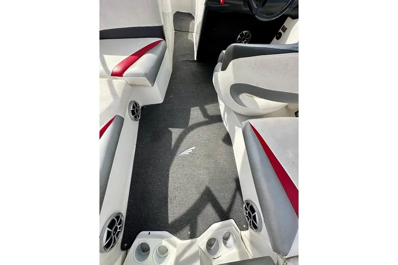 Slide: The Image of Interior of a 2012 Tigé R20 boat with gray and red seating. - 20