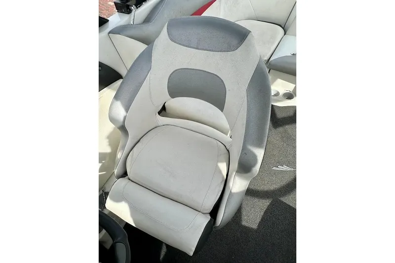 Slide: The Image of 2012 Tigé R20 boat seat, gray and white upholstery, modern design. - 21