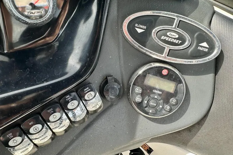 Slide: The Image of Control panel of a 2012 Tigé R20 boat with speed and audio settings. - 24