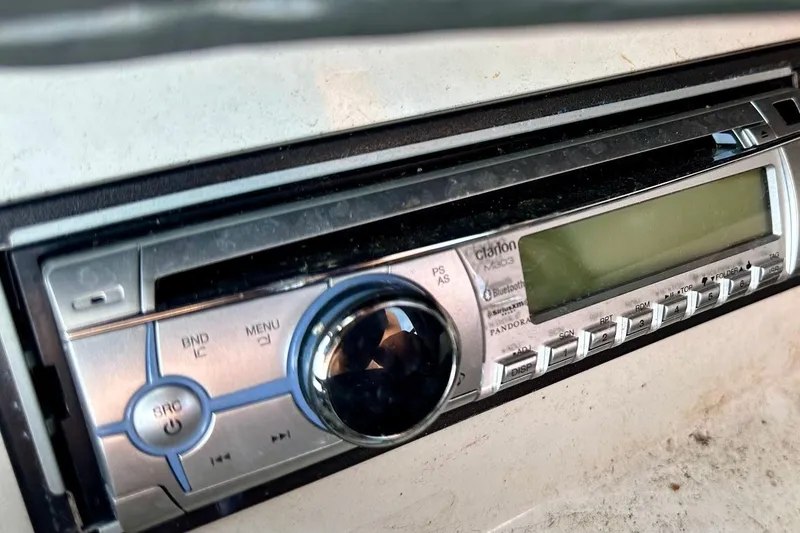 Slide: The Image of Close-up of a Clarion stereo system in a 2012 Tigé R20 boat. - 28