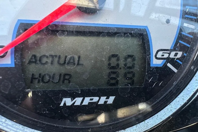 Slide: The Image of Close-up of a 2012 Tigé R20 speedometer showing 60 MPH and 68 hours. - 31