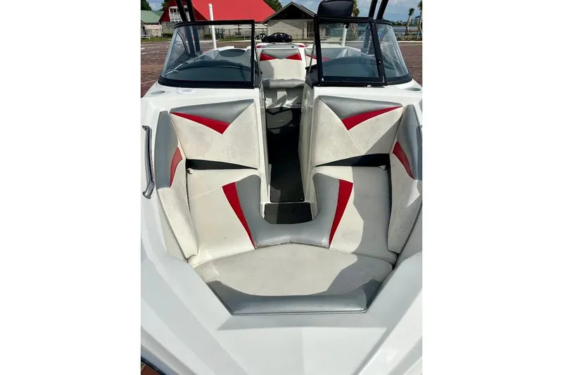 Slide: The Image of 2012 Tigé R20 boat interior with red and white seating, open bow design. - 7