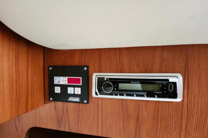Slide: The Image of Control panel and Kenwood stereo on 2000 Tiara Yachts 3100 Open. - 19