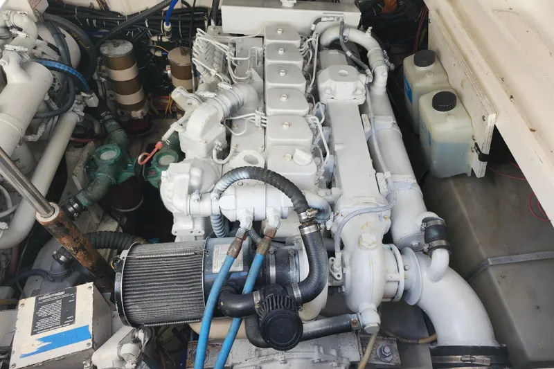 Slide: The Image of Engine compartment of a 2000 Tiara Yachts 3100 Open, showcasing detailed mechanical components. - 25