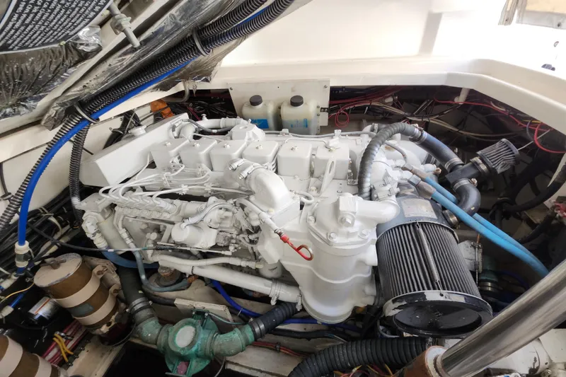 Slide: The Image of Engine compartment of a 2000 Tiara Yachts 3100 Open, showcasing detailed mechanical components. - 27