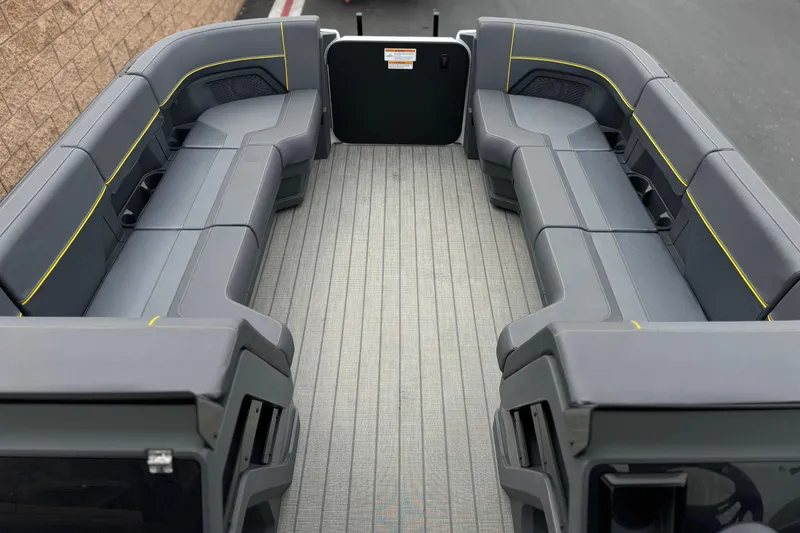 Slide: The Image of 2025 Manitou EXPLORE 24 boat interior with spacious seating and modern design. - 10