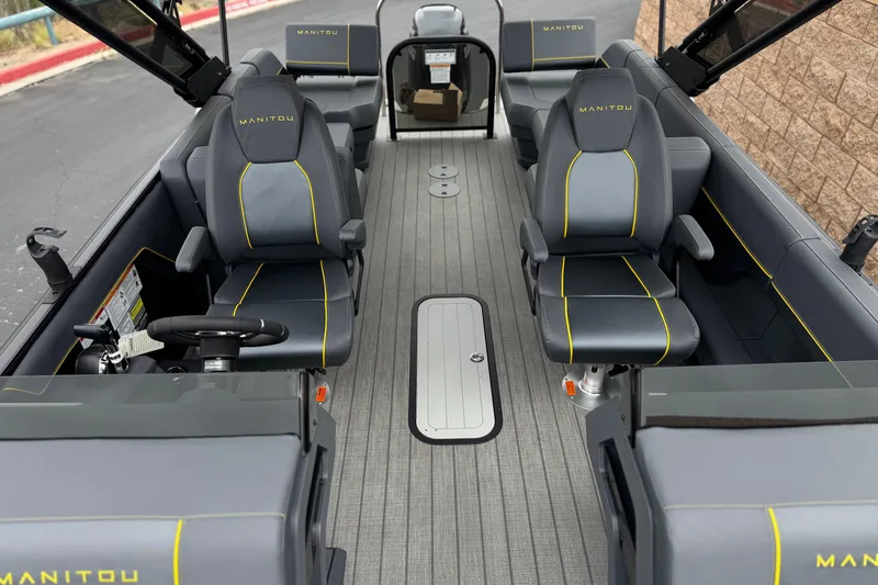 Slide: The Image of Interior of 2025 Manitou EXPLORE 24 boat with sleek seating and modern design. - 13