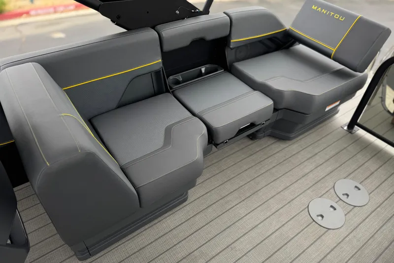 Slide: The Image of Luxurious seating on 2025 Manitou EXPLORE 24 boat with sleek gray upholstery. - 15