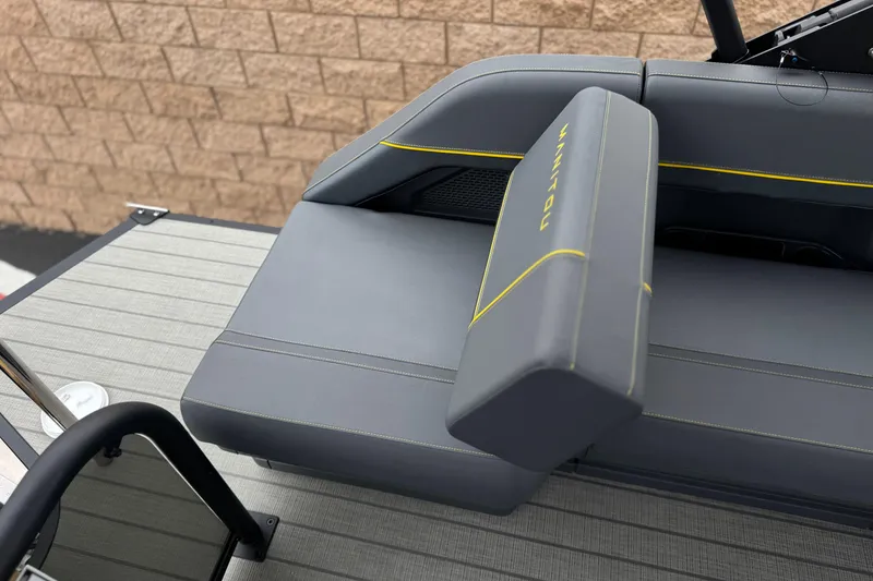 Slide: The Image of 2025 Manitou EXPLORE 24 boat seat with gray upholstery and yellow accents. - 20