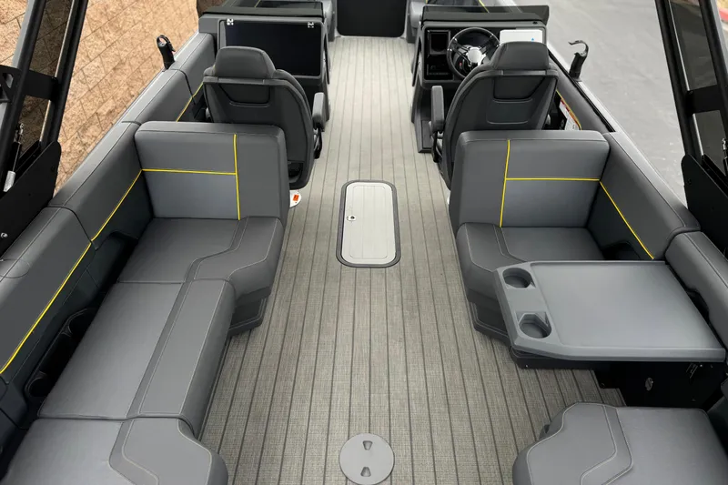Slide: The Image of Interior of 2025 Manitou EXPLORE 24 boat with gray seating and modern design. - 21