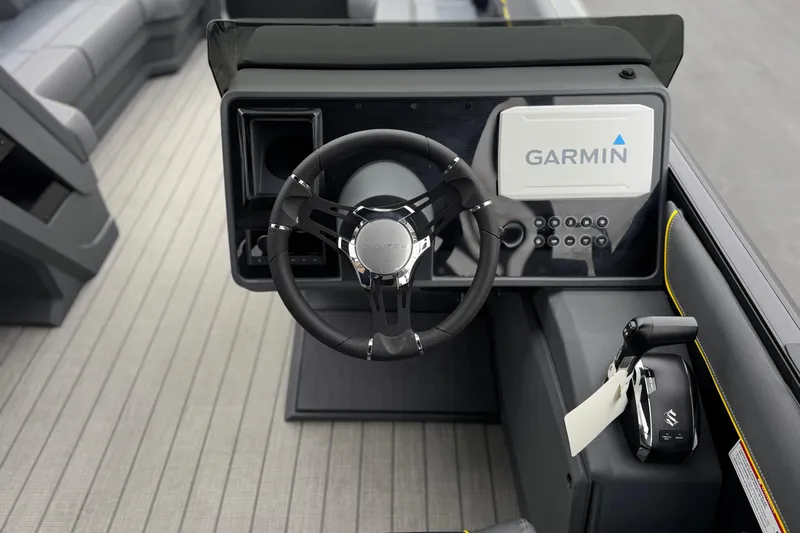 Slide: The Image of Steering console of 2025 Manitou EXPLORE 24 with Garmin navigation system. - 26