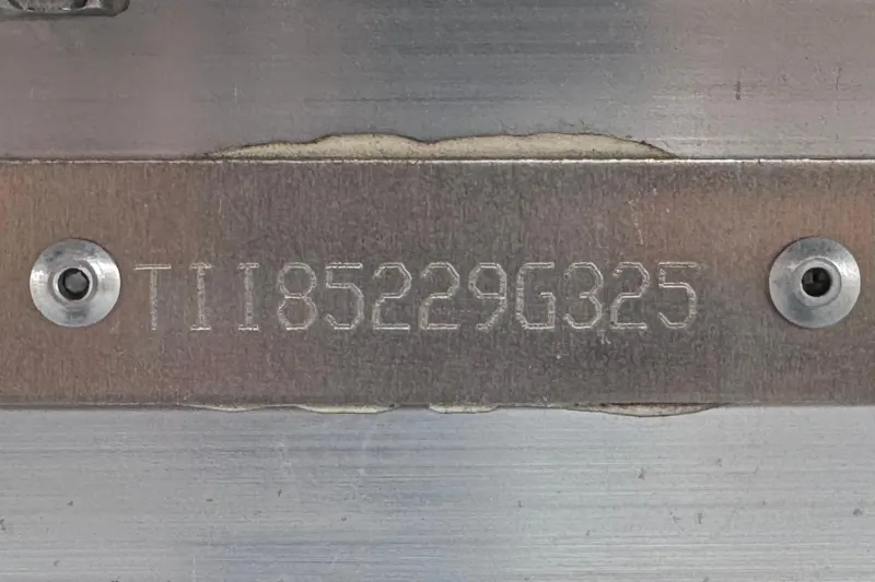 Slide: The Image of Serial number plate on 2025 Manitou EXPLORE 24, displaying "TII85229G325". - 30