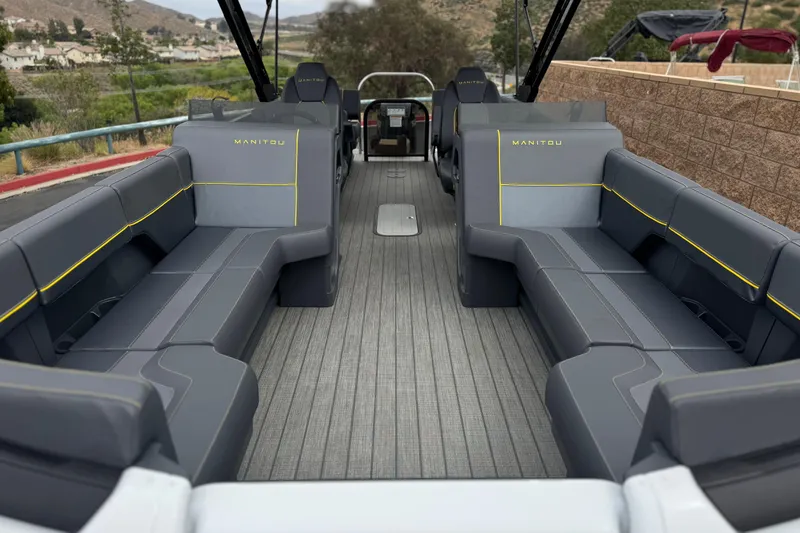 Slide: The Image of Interior view of 2025 Manitou EXPLORE 24 pontoon boat with spacious seating. - 9