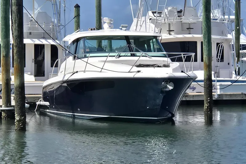 The Image of 2022 Tiara Yachts 43 LE docked at marina, front view. - 0