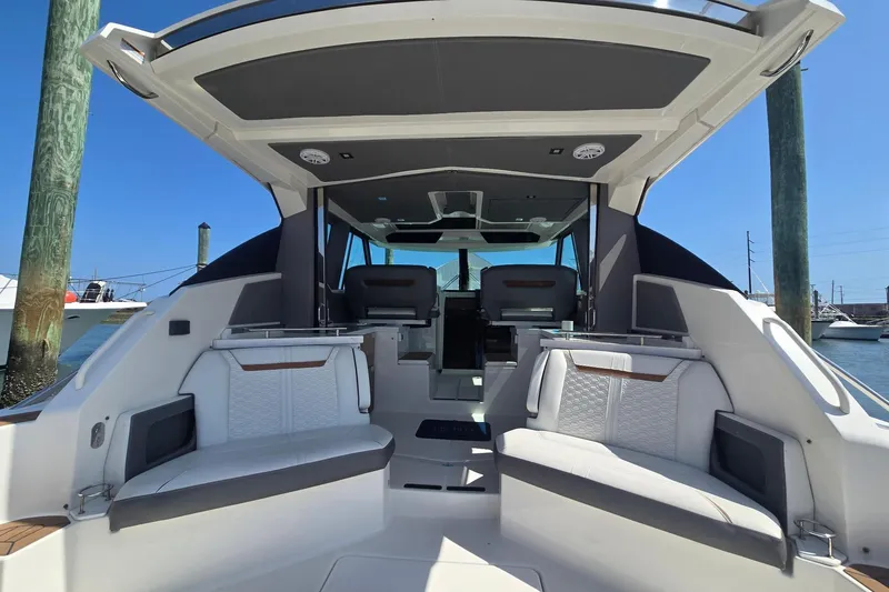 Slide: The Image of 2022 Tiara Yachts 43 LE interior with luxurious seating and modern design. - 17