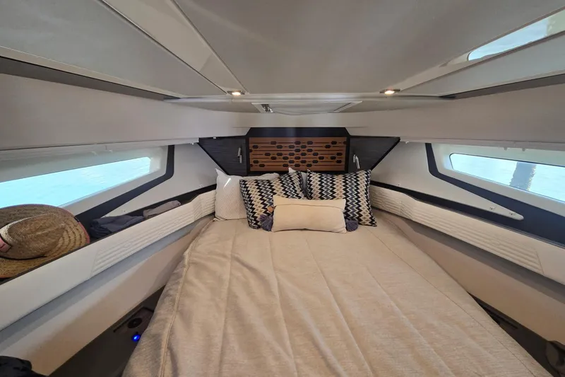 Slide: The Image of Luxurious interior cabin of 2022 Tiara Yachts 43 LE with stylish bedding and modern design. - 29