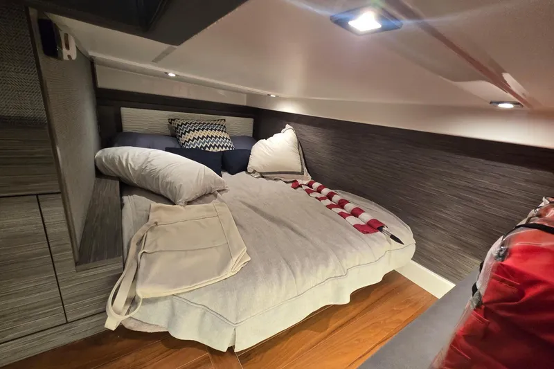 Slide: The Image of Cozy cabin interior of 2022 Tiara Yachts 43 LE with stylish bedding and modern lighting. - 31