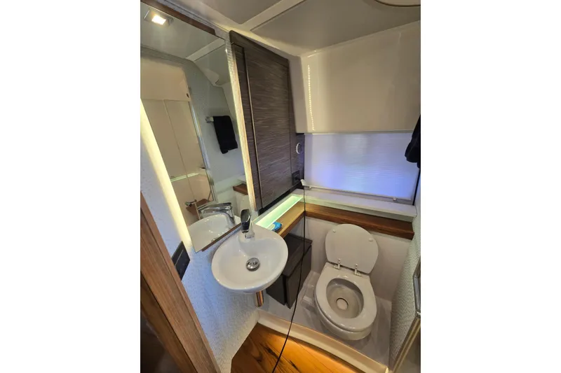 Slide: The Image of Luxurious bathroom in 2022 Tiara Yachts 43 LE, featuring modern sink and toilet. - 32